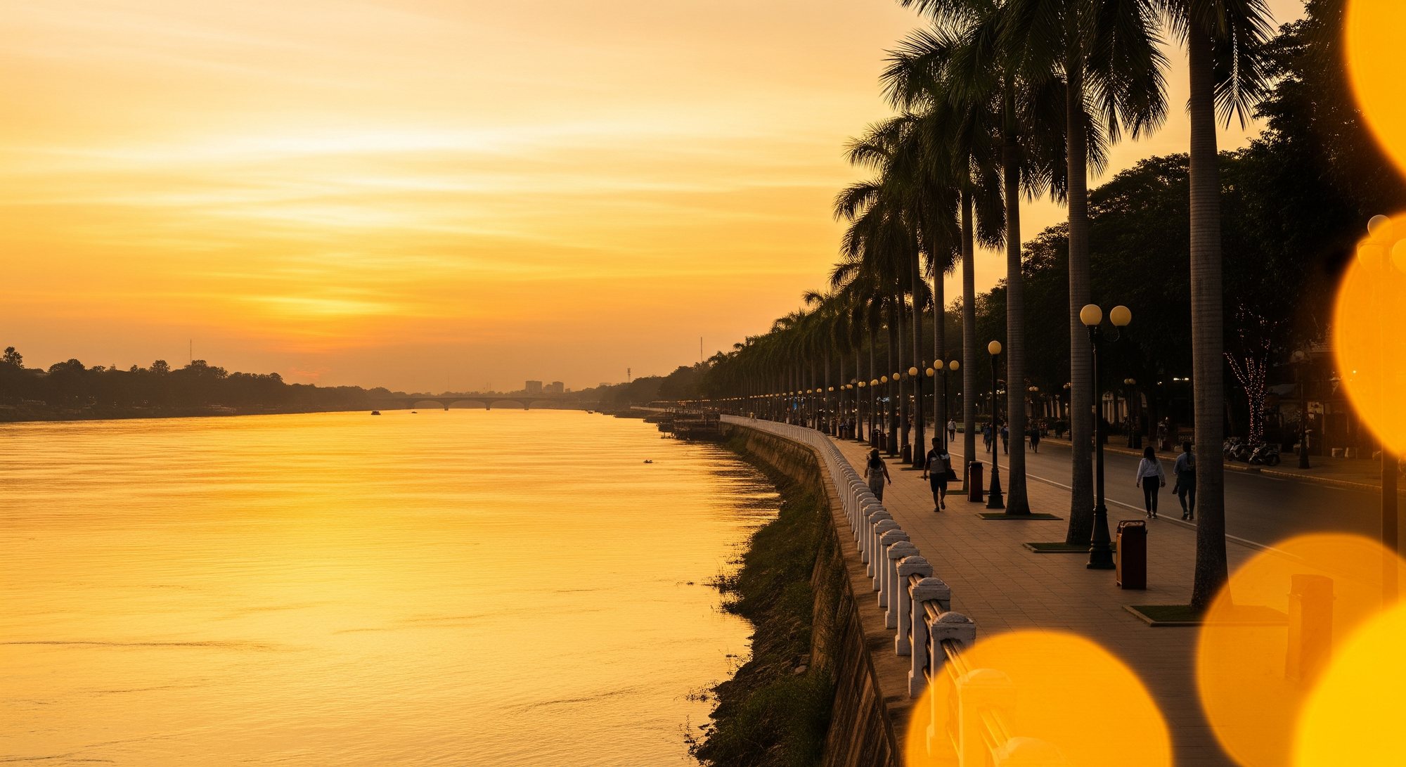 The Mekong River glowing gold at sunset in Vientiane, Laos
